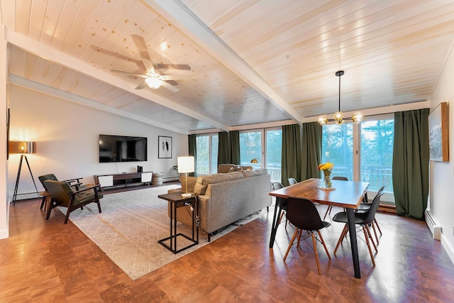 dining area with ceiling fan with notable chandelier, baseboard heating, a wealth of natural light, and wood ceiling