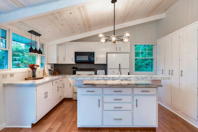 kitchen with lofted ceiling with beams, white appliances, white cabinetry, and pendant lighting