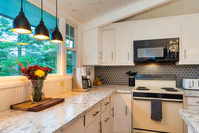 kitchen with decorative light fixtures, a wealth of natural light, white range with electric stovetop, and white cabinetry