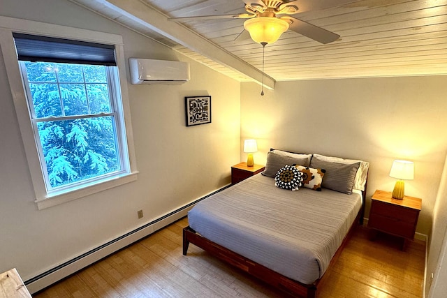 bedroom featuring a baseboard heating unit, ceiling fan, a wall mounted AC, and hardwood / wood-style flooring