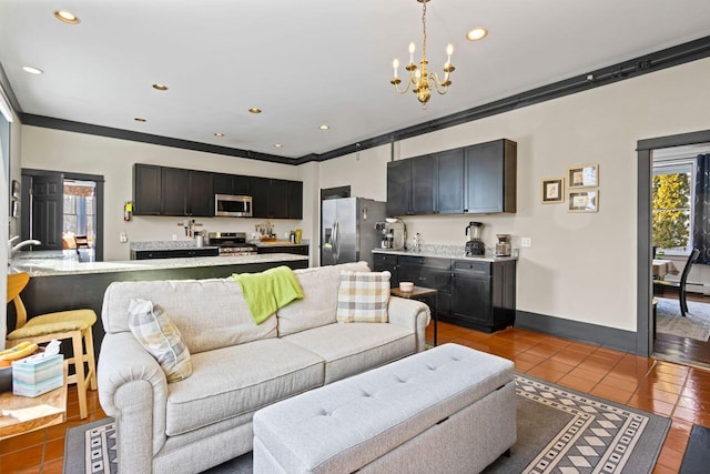 living room with ornamental molding, light tile patterned floors, and an inviting chandelier