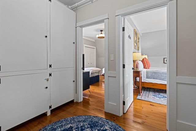 corridor with wood-type flooring