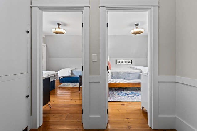 corridor with wood-type flooring