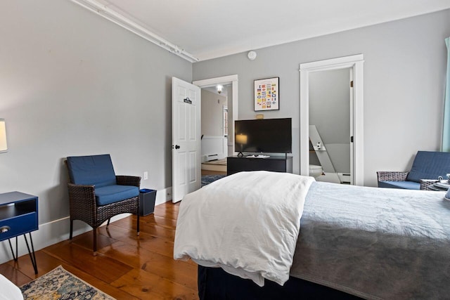 bedroom with dark wood-type flooring