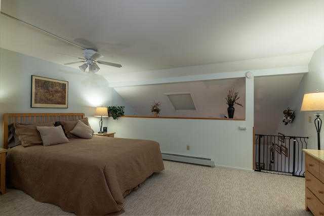 bedroom with ceiling fan, baseboard heating, light colored carpet, and vaulted ceiling