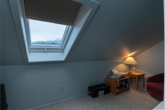 bonus room featuring vaulted ceiling and carpet flooring