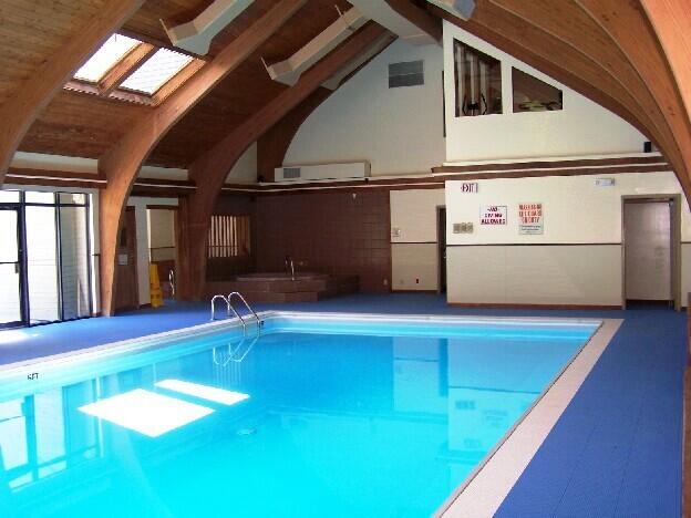 view of swimming pool with a skylight