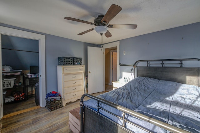 bedroom featuring dark hardwood / wood-style flooring and ceiling fan