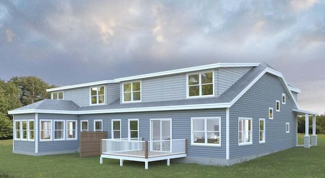 rear view of house featuring a wooden deck and a yard