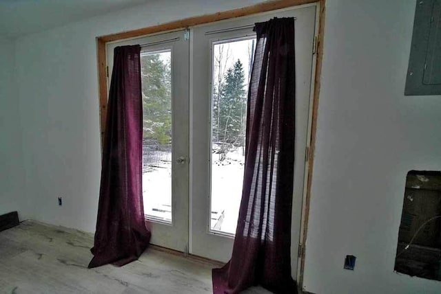 doorway to outside featuring electric panel and french doors