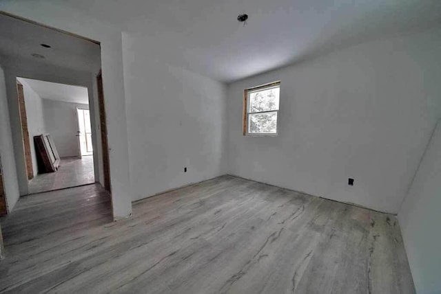 spare room featuring light hardwood / wood-style floors