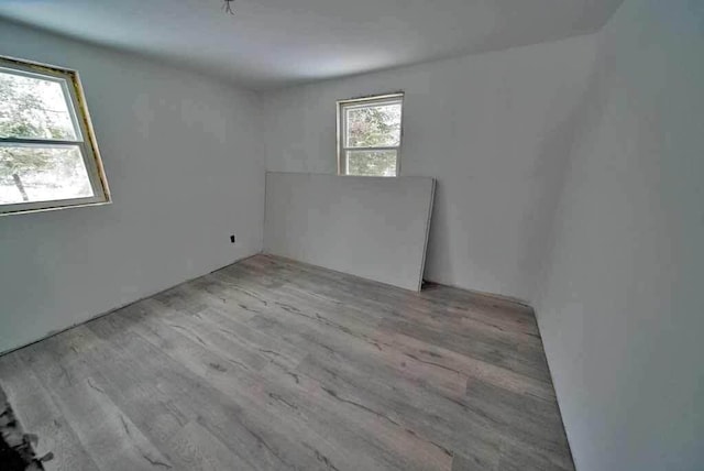 unfurnished room with light hardwood / wood-style flooring