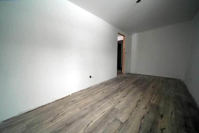 spare room featuring light wood-type flooring