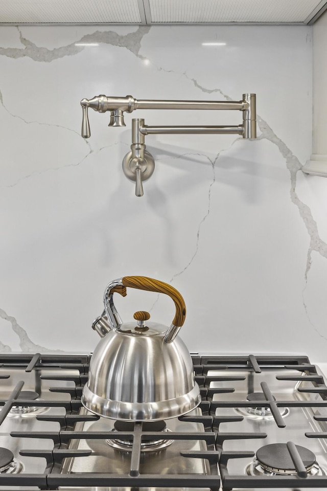 interior details featuring stove and stone countertops