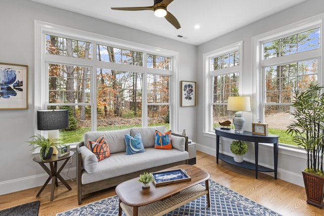 sunroom / solarium with ceiling fan and a wealth of natural light