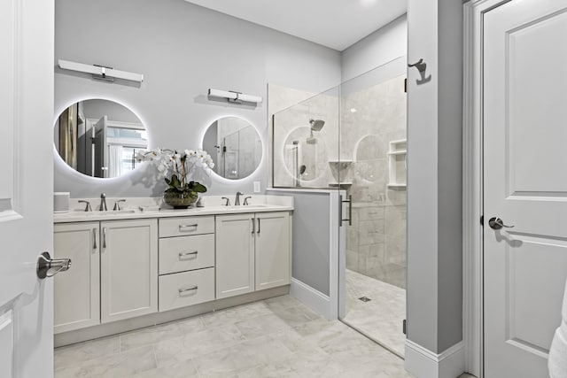 bathroom with an enclosed shower and vanity