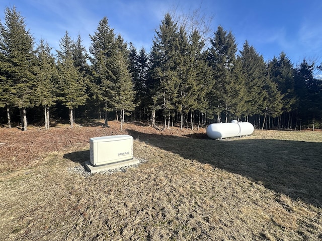 view of storm shelter with a yard