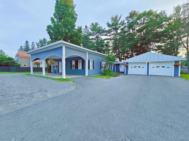 ranch-style home featuring a garage