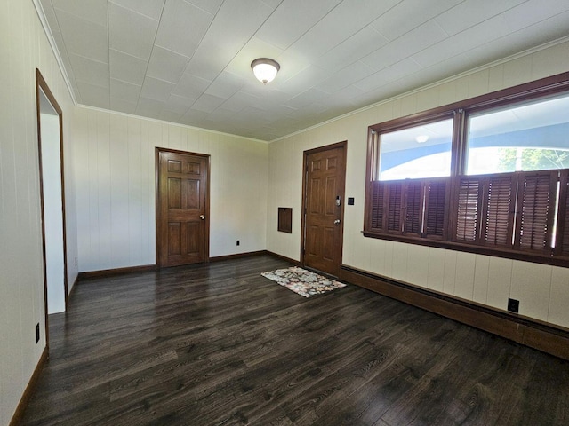 entryway featuring dark hardwood / wood-style floors and ornamental molding