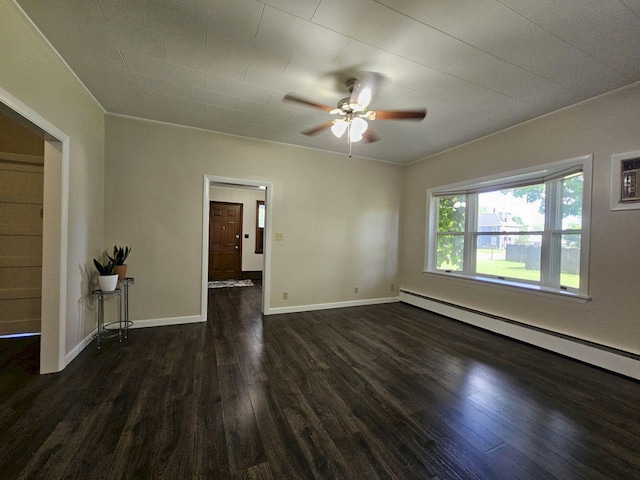 spare room with ceiling fan, a baseboard radiator, and dark hardwood / wood-style floors