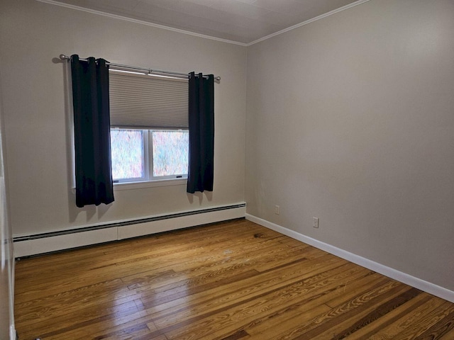 unfurnished room with crown molding, wood-type flooring, and a baseboard radiator