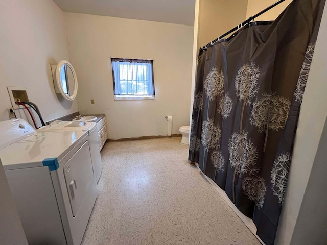 laundry area with washing machine and clothes dryer