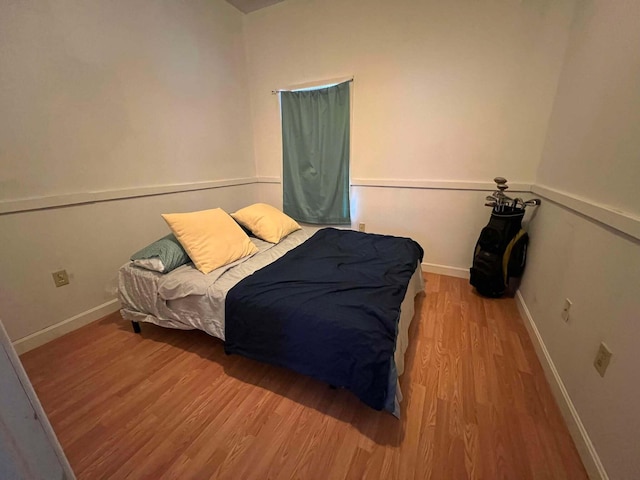 bedroom featuring hardwood / wood-style floors