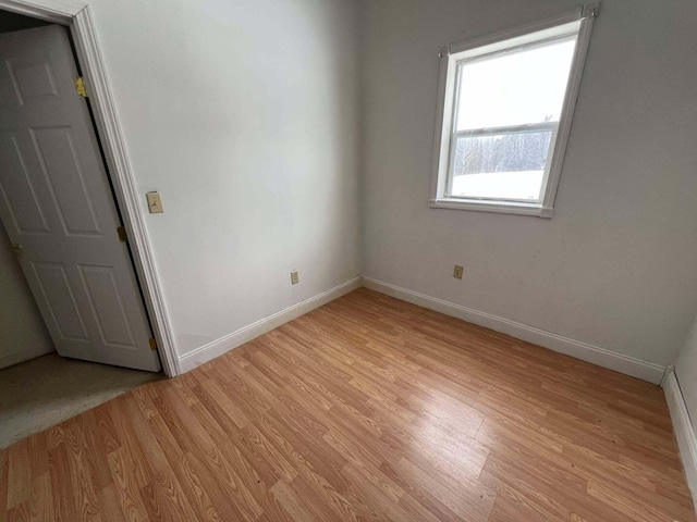 unfurnished room featuring light wood-type flooring