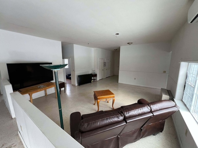 living room featuring a wall unit AC