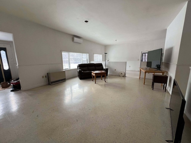 living room with a wall unit AC