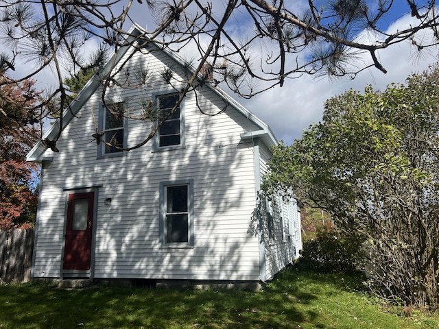 view of home's exterior featuring a lawn