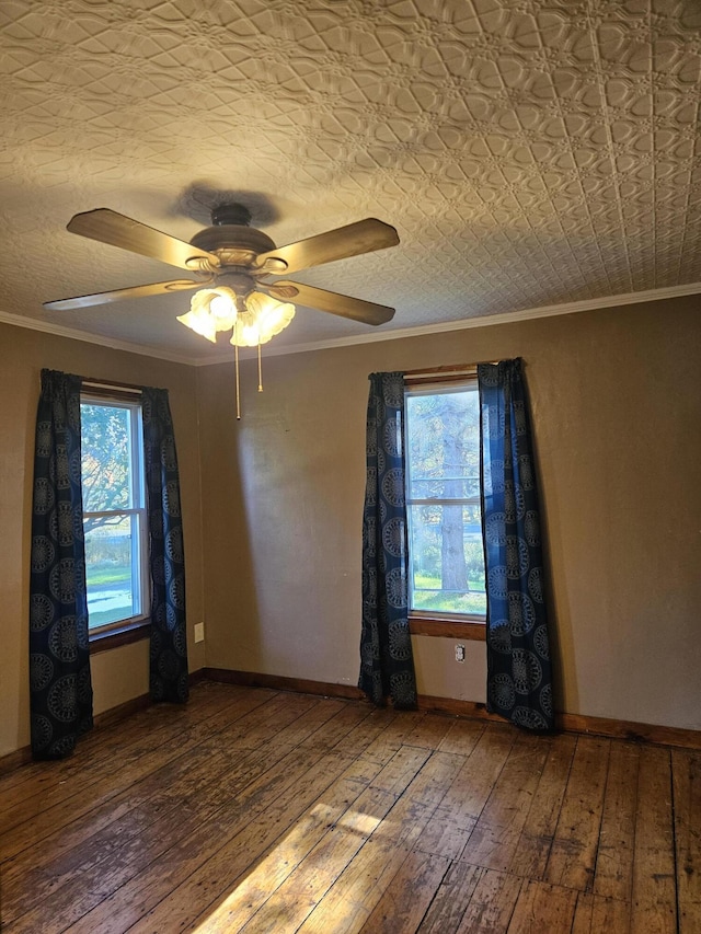 spare room with ceiling fan, wood-type flooring, and crown molding