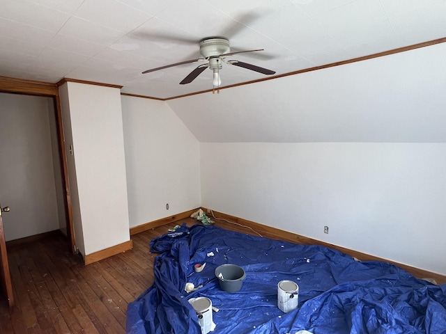 unfurnished bedroom featuring ceiling fan, ornamental molding, and dark hardwood / wood-style floors