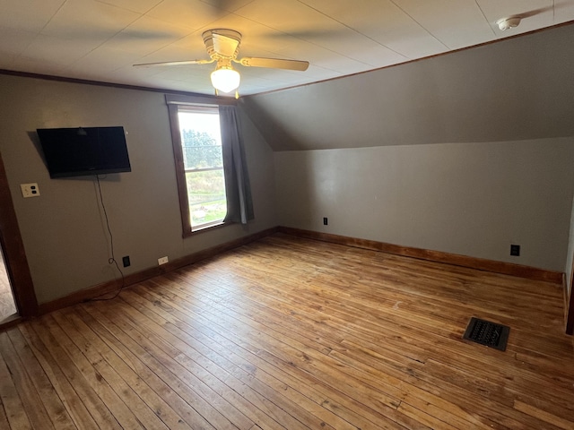 additional living space featuring ceiling fan, vaulted ceiling, and light hardwood / wood-style floors