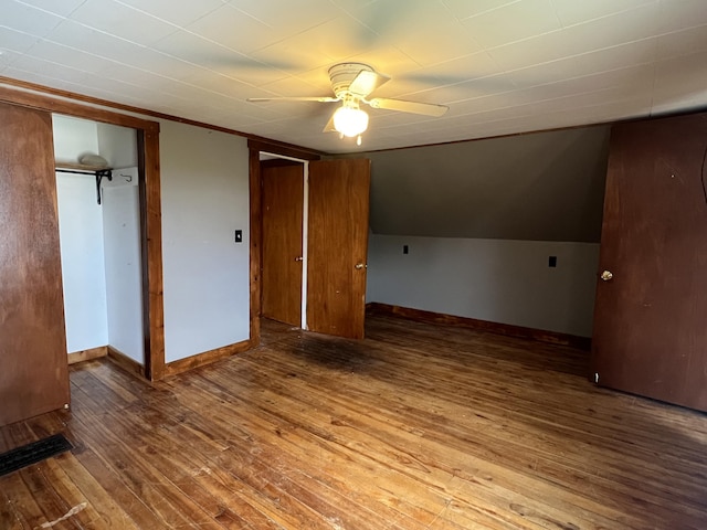 unfurnished bedroom with ceiling fan and hardwood / wood-style flooring