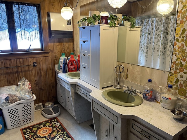 bathroom with vanity and wooden walls