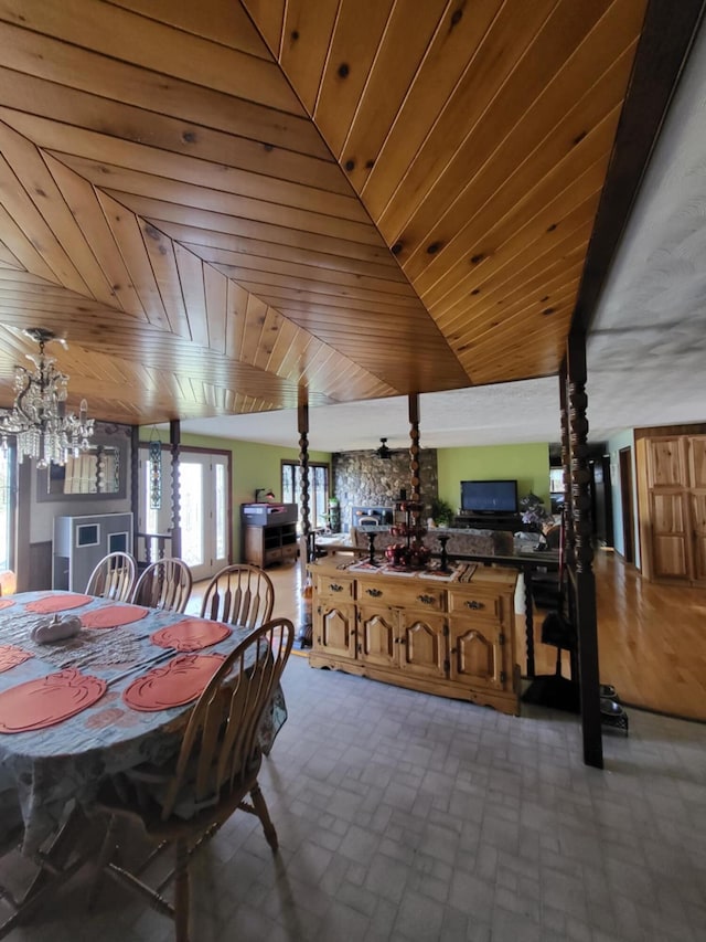 dining room with wooden ceiling and an inviting chandelier