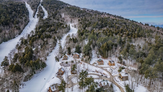 snowy aerial view with a mountain view