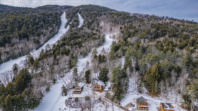 snowy aerial view with a mountain view