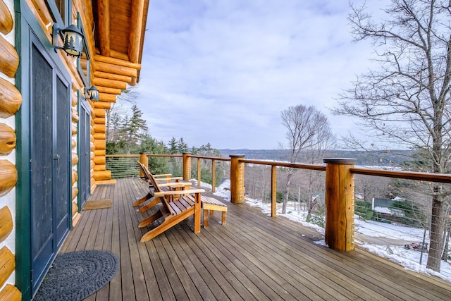 view of snow covered deck