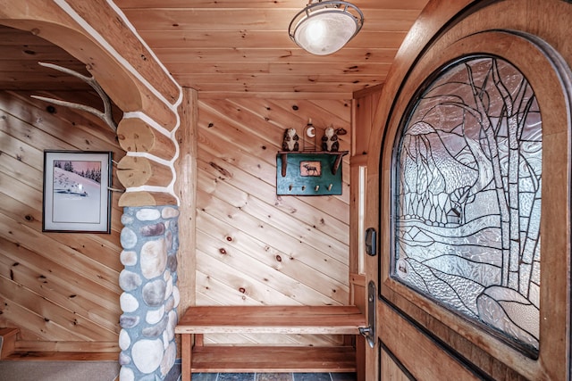 interior details featuring wood ceiling and wood walls