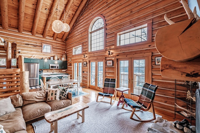 living room featuring log walls, french doors, high vaulted ceiling, wooden ceiling, and beam ceiling