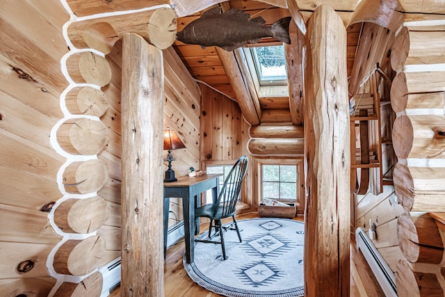 unfurnished office featuring baseboard heating, vaulted ceiling with skylight, log walls, and wood ceiling