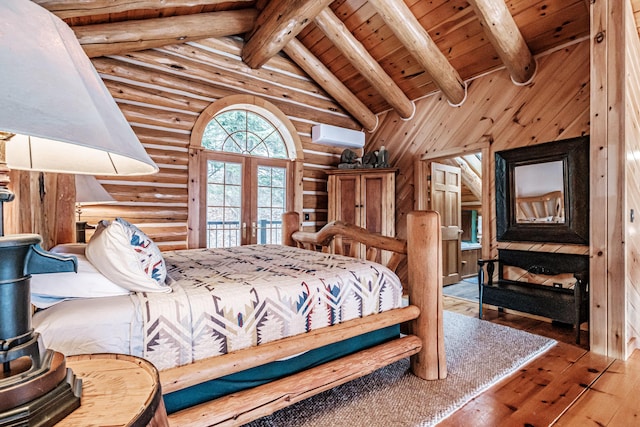 bedroom featuring french doors, log walls, hardwood / wood-style flooring, and beamed ceiling