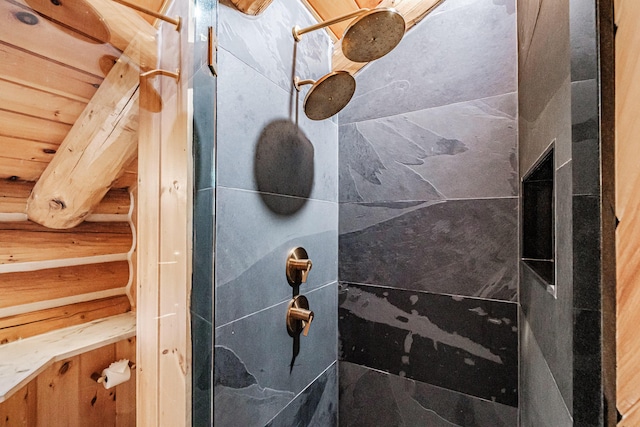 bathroom with wooden ceiling and a tile shower