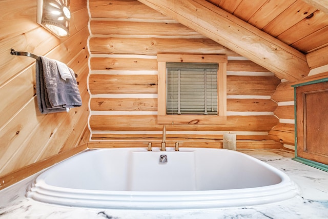 bathroom featuring a tub and log walls