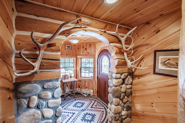 entryway featuring a baseboard heating unit and wooden ceiling