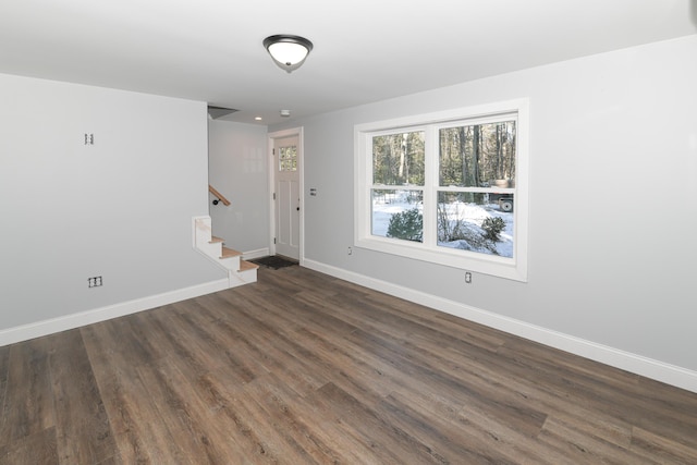 empty room featuring dark wood-type flooring