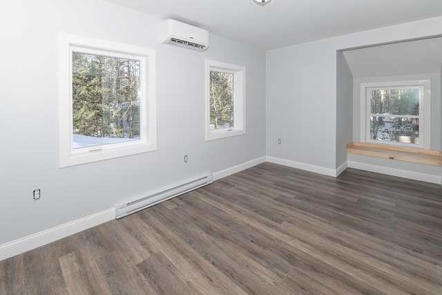 unfurnished room with dark wood-type flooring, a wall mounted AC, and a baseboard heating unit