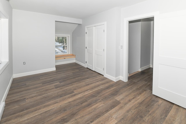 spare room with dark hardwood / wood-style floors